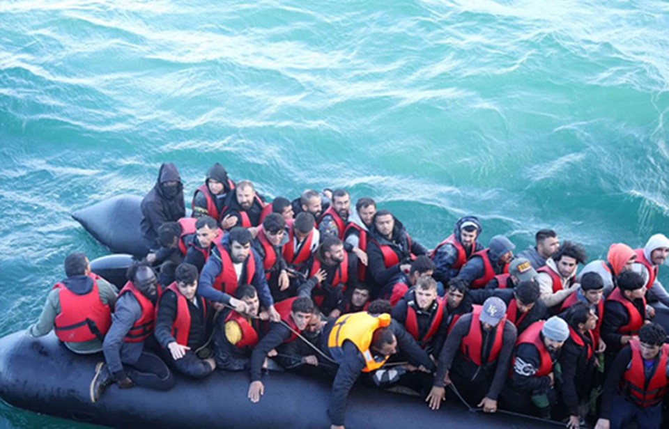 Handout photo issued by Home Office of Choul Phan Maker (back left) piloting a vessel packed with 52 endangered passengers on 15 August last year. Maker has been jailed for 20 months for smuggling more than 50 migrants across the English Channel in a "perilously overcrowded dinghy". The 31-year-old from South Sudan was sentenced at Winchester Crown Court for offences of unlawful arrival and assisting unlawful immigration after making the crossing which "endangered" the 52 passengers on board the boat. Issue date: Thursday March 21, 2024. PA Photo. See PA story COURTS SmallBoat. Photo credit should read: Home Office /PA Wire NOTE TO EDITORS: This handout photo may only be used in for editorial reporting purposes for the contemporaneous illustration of events, things or the people in the image or facts mentioned in the caption. Reuse of the picture may require further permission from the copyright holder.