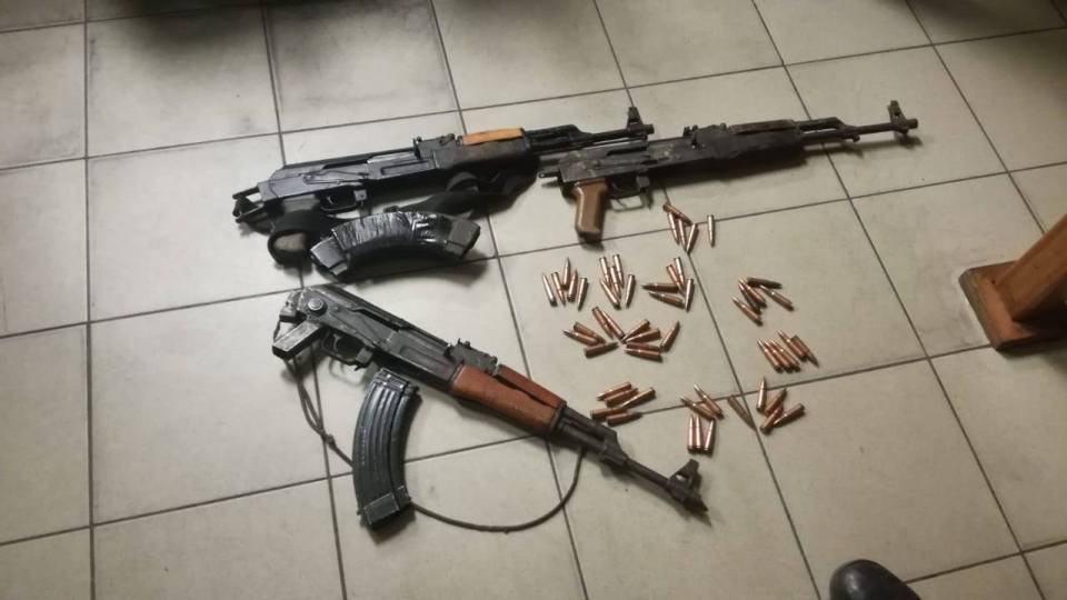A cache of illegal firearms found by police during a raid on suspected assassin's home