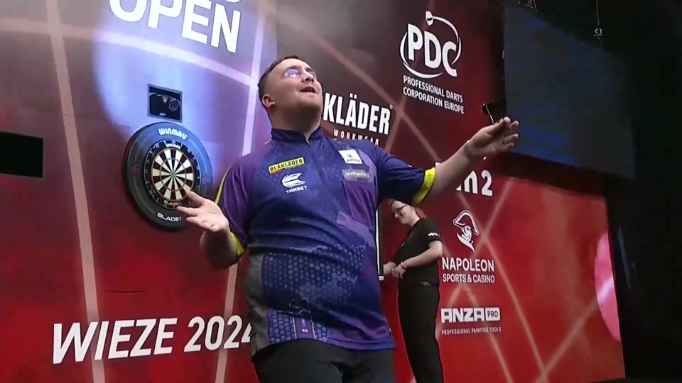 The Nuke enjoys a victory dance after beating Rob Cross