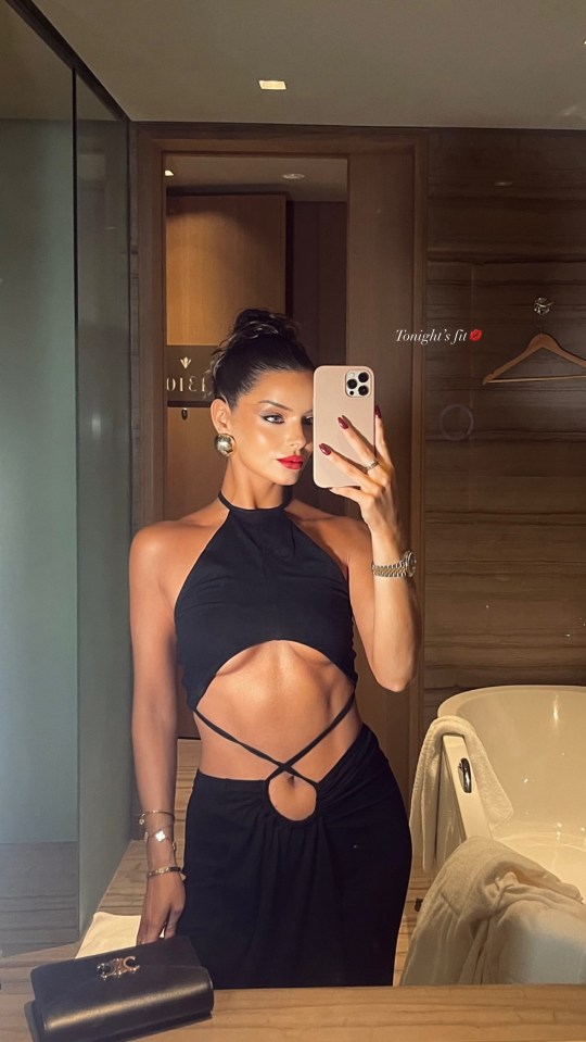 Maura Higgins sizzled as she flashed her abs in a black cut-out dress