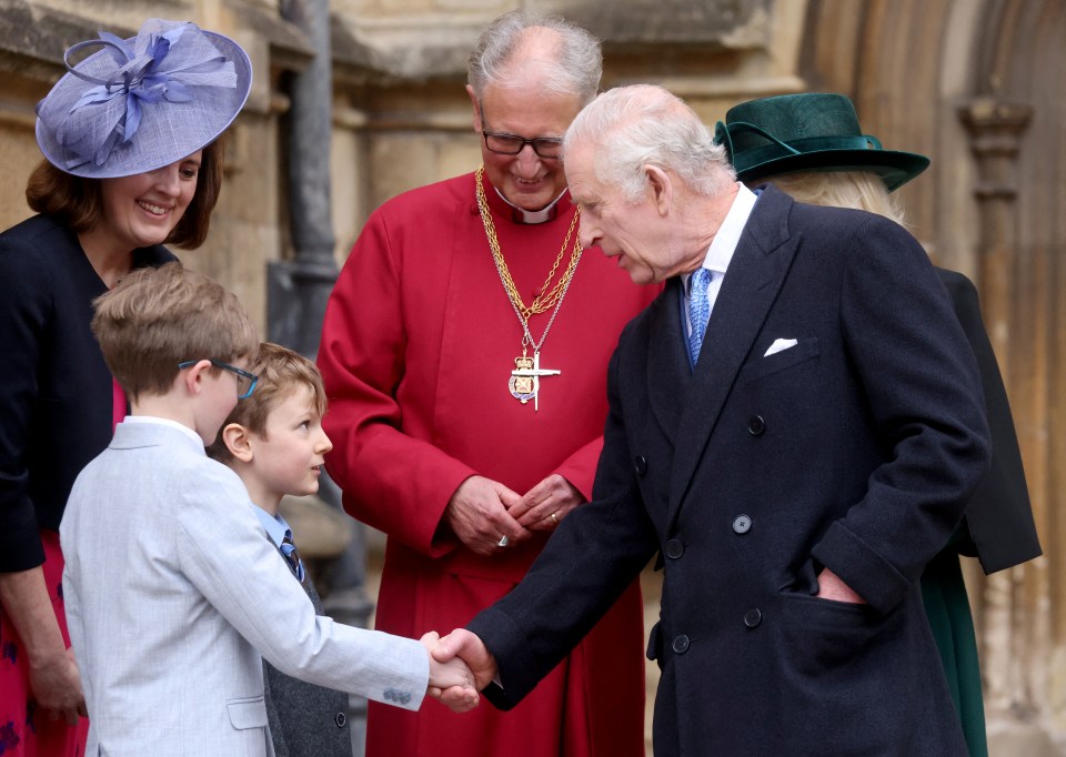 The King chatted to a boy outside St George's Chapel at Windsor
