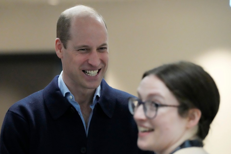 Prince William smiles during his visit today