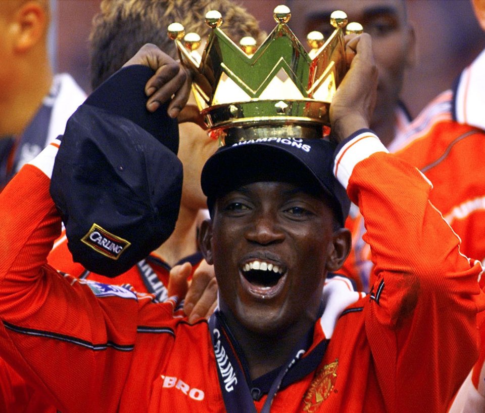 Dwight Yorke of Manchester United holding the Premiership trophy.