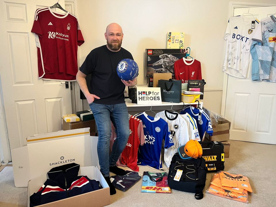 Former soldier Russell Webb, 36, with thousands of pounds worth of prizes ahead of Saturday’s Help 4 Heroes fund-raising raffle