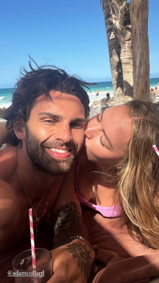 Laura Woods planted a kiss on boyfriend Adam Collard's cheek during a holiday together