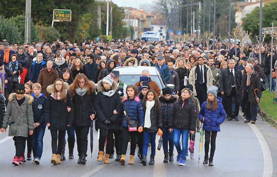 Giulio's hearse being taken through Italy followed by mourners