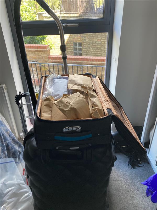 Cops found cash hidden in a suitcase under a bed when they raided properties