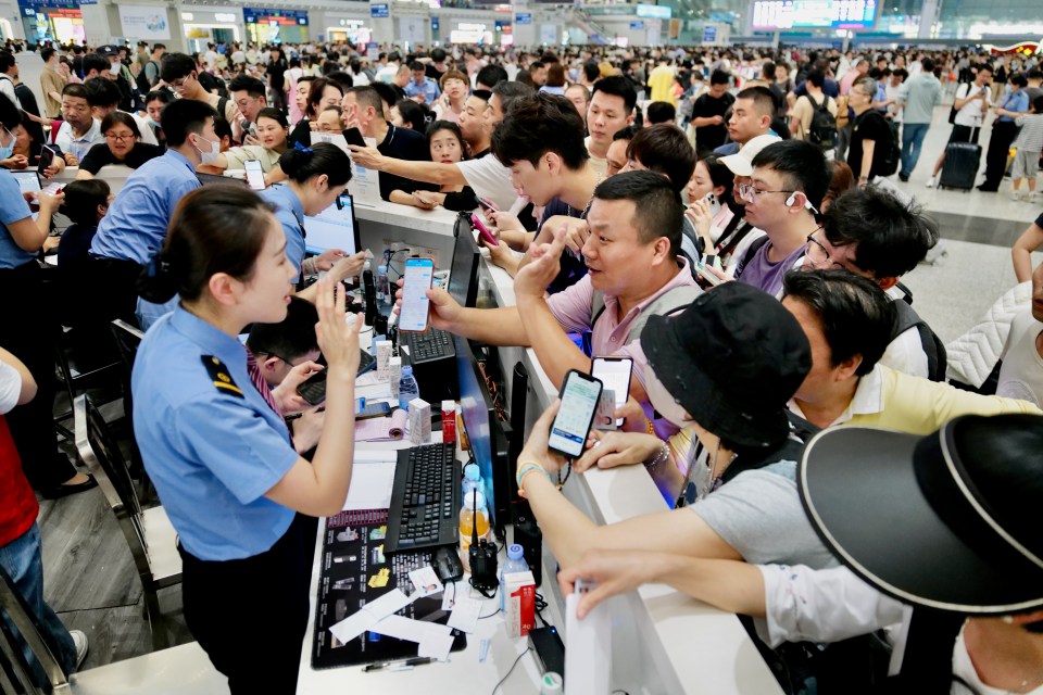 Passengers wait at the Shenzhen North Railway Station