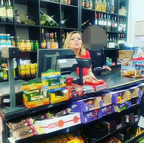 Galina Nikolov behind the counter of a corner shop the gang was using