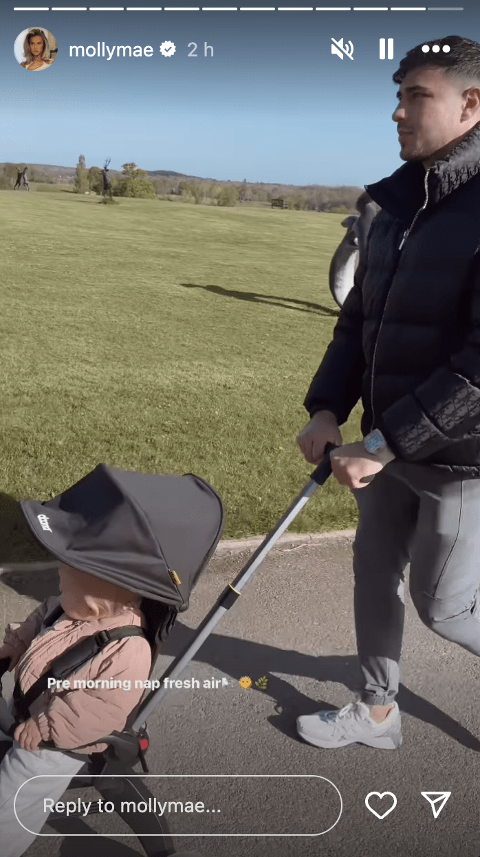 a man pushing a baby in a stroller with a reply to mollymae at the bottom