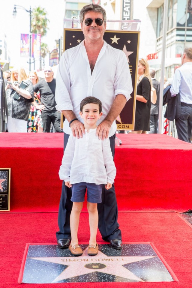 Simon Cowell and his son at his Hollywood Walk of Fame star ceremony.
