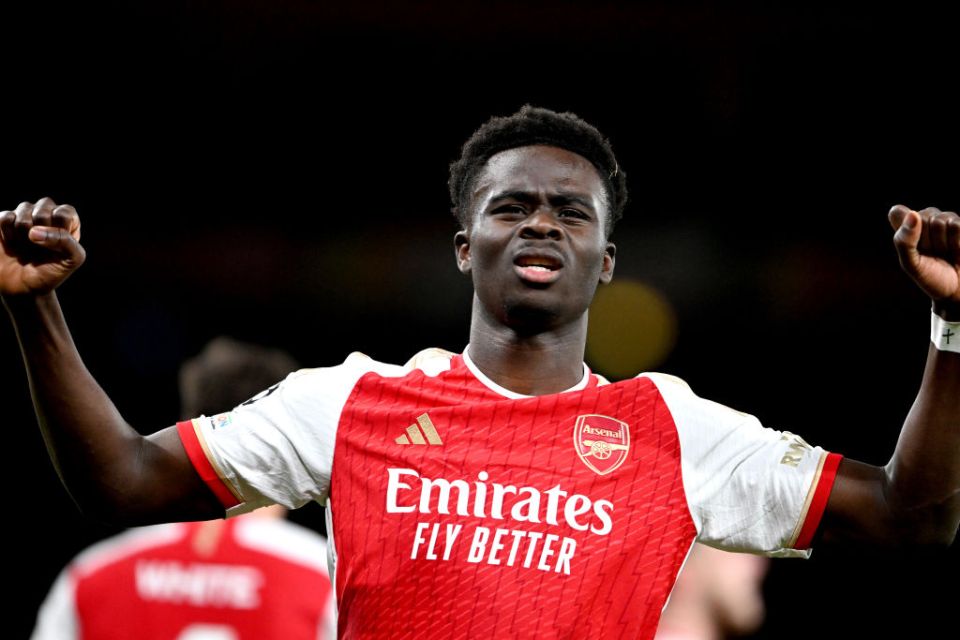 LONDON, ENGLAND - APRIL 09: Bukayo Saka of Arsenal celebrates scoring his team's first goal during the UEFA Champions League quarter-final first leg match between Arsenal FC and FC Bayern MÃ¼nchen at Emirates Stadium on April 09, 2024 in London, England. (Photo by Stuart MacFarlane/Arsenal FC via Getty Images)