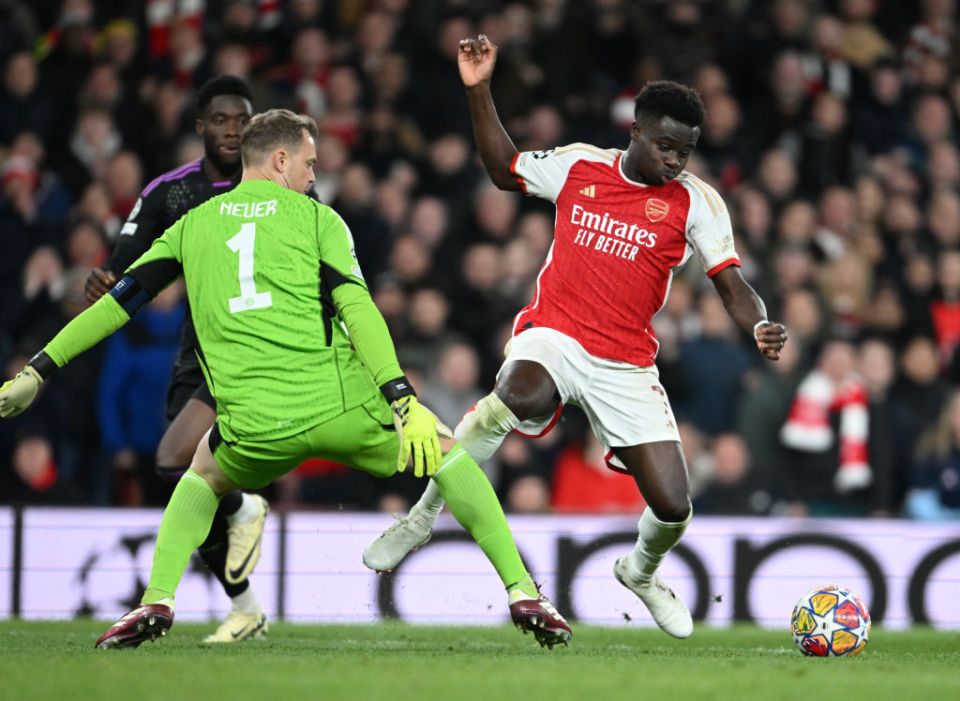 LONDON, ENGLAND - APRIL 09: Arsenal's Bukayo Saka goes down after a challenge by Bayern Munich goalkeeper Manuel Neuer during the UEFA Champions League quarter-final first leg match between Arsenal FC and FC Bayern MÃ¼nchen at Emirates Stadium on April 09, 2024 in London, England. (Photo by Stuart MacFarlane/Arsenal FC via Getty Images)