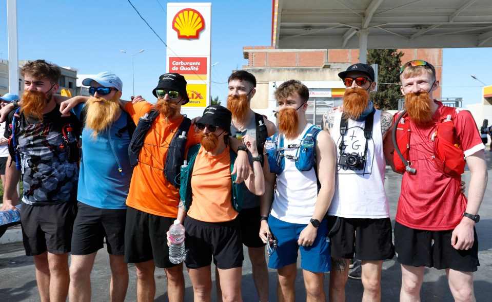 Britain's Russ Cook becomes the first person to run the entire length of Africa - Mateur, Tunisia - April 7, 2024 People wearing fake beards pose as they wait for Britain's Russ Cook in Mateur, Tunisia REUTERS/Zoubeir Souissi