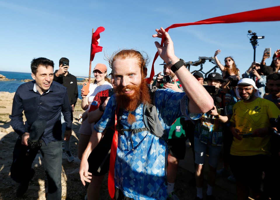 Britain's Russ Cook becomes the first person to run the entire length of Africa - Tunisia - April 7, 2024 Britain's Russ Cook reacts after becoming the first person to run the entire length of Africa REUTERS/Zoubeir Souissi