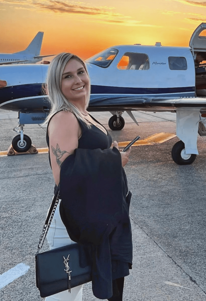 Woman standing in front of a private jet.