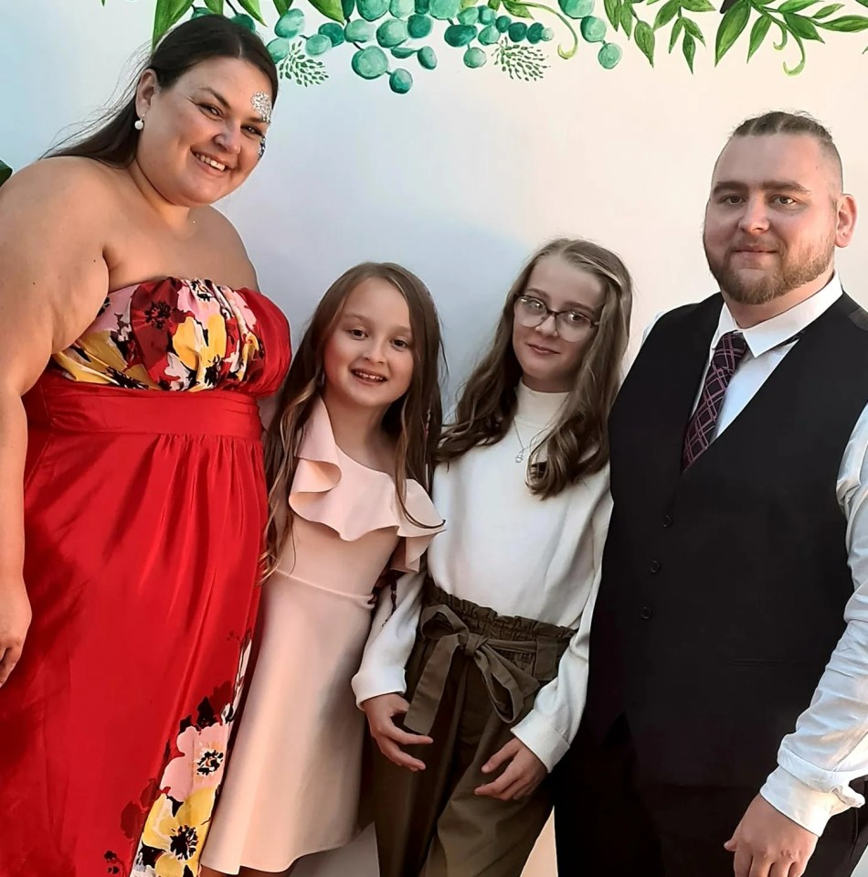 Charlotte with husband Alan and two daughters
