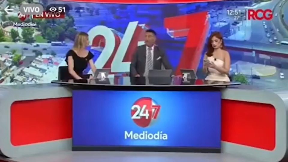 One news anchor let out a gasp as another shifted uncomfortably in his seat