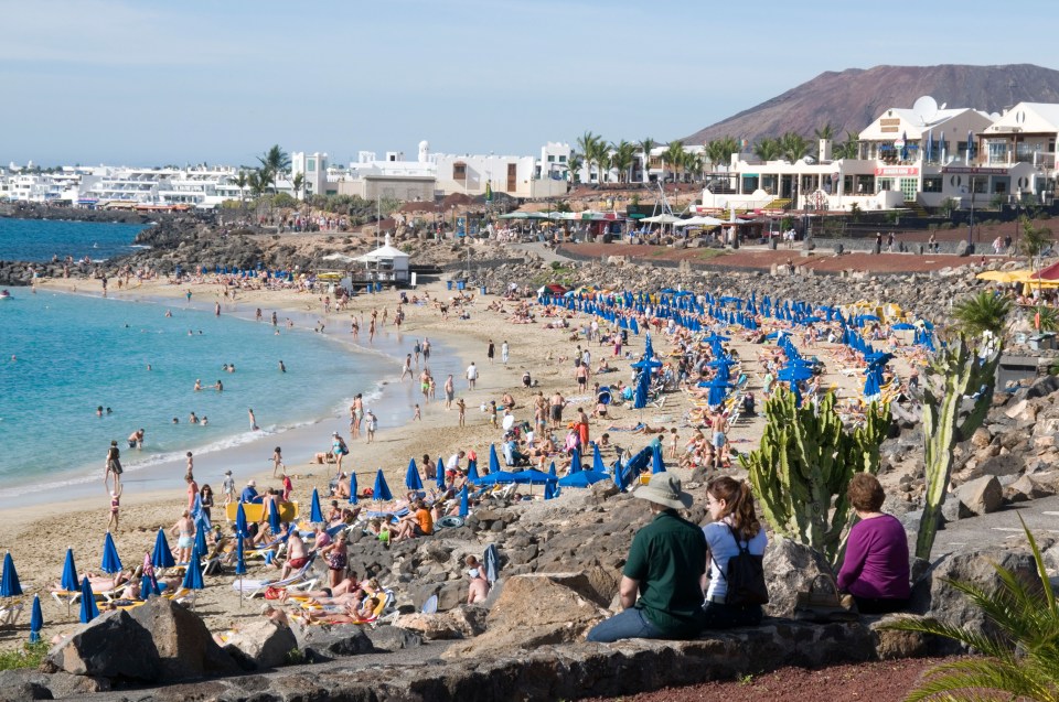 A busy Lanzarote beach - where angry residents are warning off Brit tourists