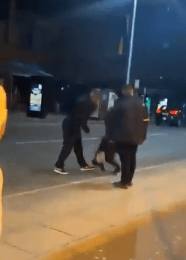 The man puts his hands out in front of him to protect his head