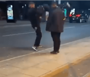 The brute bouncer lifts the man clear off the ground