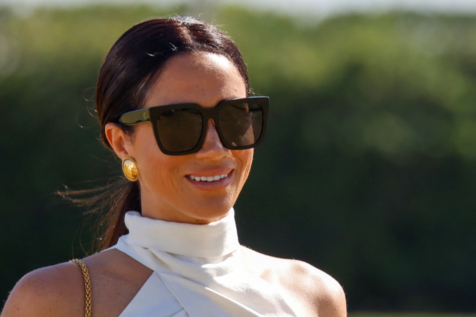 The duchess looked glamorous in her oversized sunglasses and large gold earrings