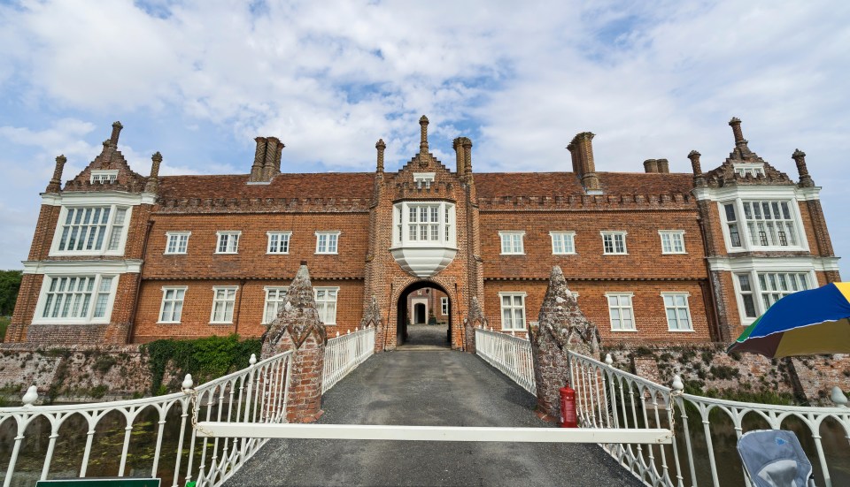 The hall can be accessed by a drawbridge over a moat