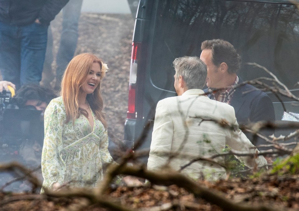 Isla had a smile on her face while chatting with her colleagues