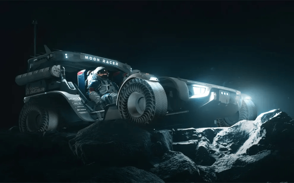 a moon racer is sitting on a rocky surface