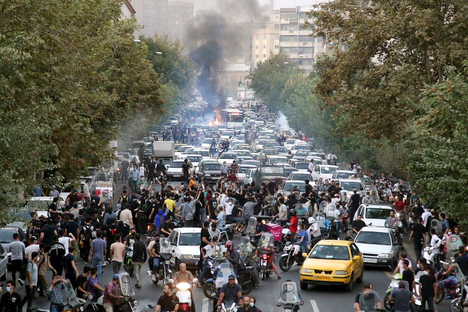 Iranian protesters chant during a protest in honour of Mahsa Amini in the capital city