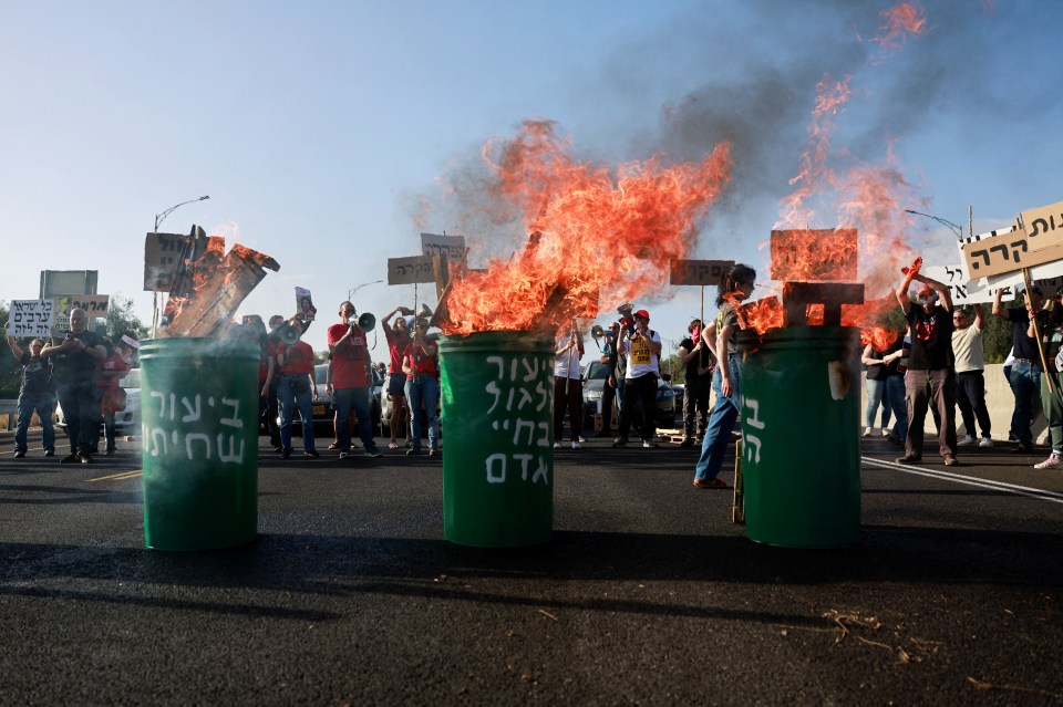 Relatives and supporters of hostages held in Gaza block traffic during a protest on April 19