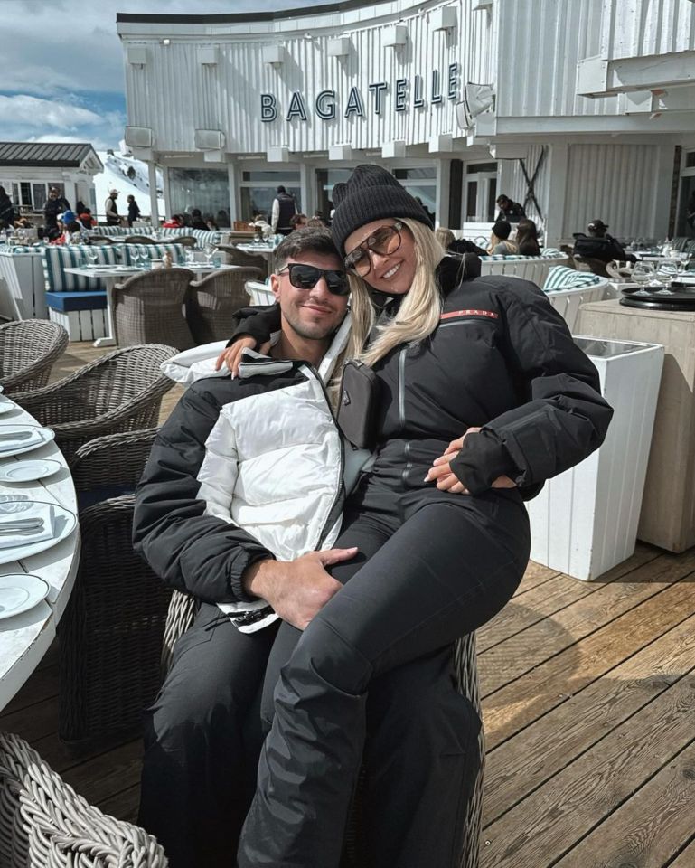 a man and woman are posing for a picture in front of bagatelle