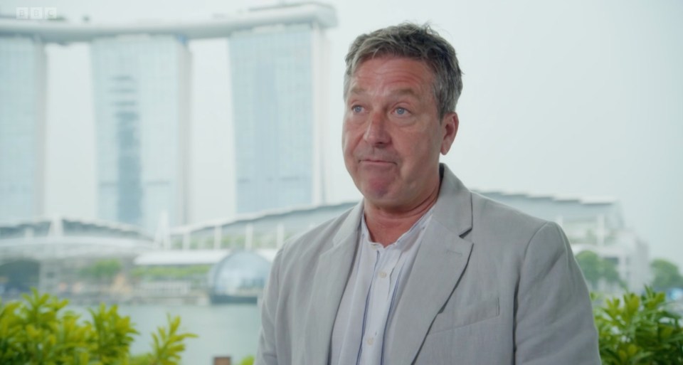 Judge John Torode stood against the stunning backdrop as he said the group would face 'challenge after challenge'