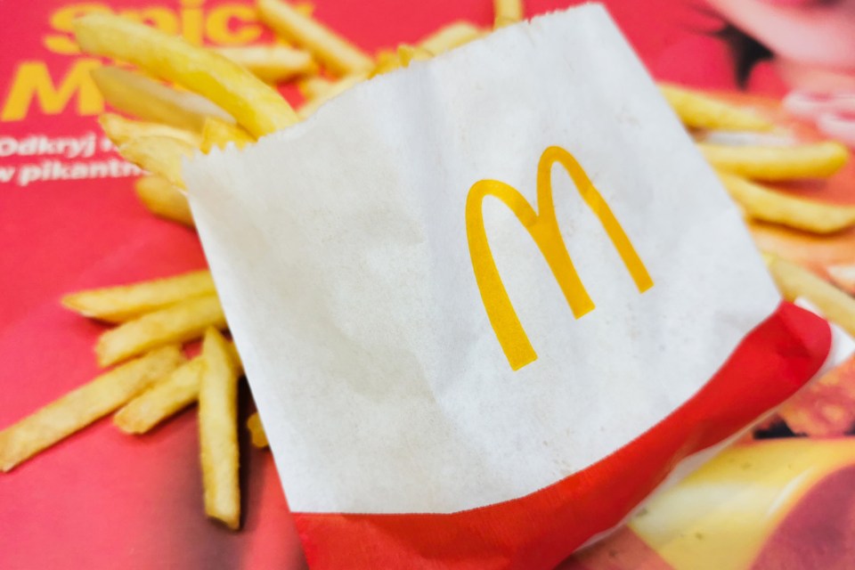 a bag of mcdonald 's french fries sits on a table