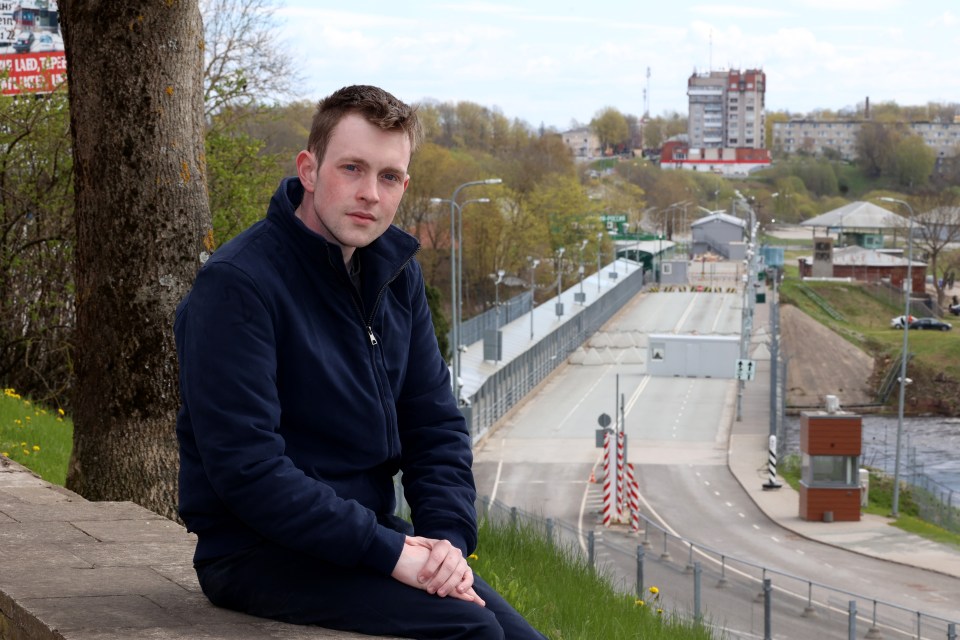 © Picture by Peter Jordan..Story by Thomas Godfrey....Interview with the Mayor of Narva in Estonia and Russian Victory Day Parade on the banks of the Narva River which connects Estonia to Russia via a 110 metre bridge which is closed to traffic but not civilians....Picture shows Sun man Thomas Godfrey in Estonia by the closed bridge to Russia...Job ID: NINTCHDBJOBS000001077164...Today Wednesday 9th May 2024.. .....The Sun Picture by Peter Jordan.