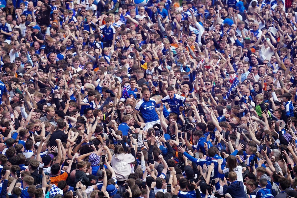 Ipswich Town's Wes Burns (centre) celebrates his sides promotion to the Premier League after the Sky Bet Championship match at Portman Road, Ipswich. Picture date: Saturday May 4, 2024. PA Photo. See PA story SOCCER Ipswich. Photo credit should read: Zac Goodwin/PA Wire. RESTRICTIONS: EDITORIAL USE ONLY No use with unauthorised audio, video, data, fixture lists, club/league logos or "live" services. Online in-match use limited to 120 images, no video emulation. No use in betting, games or single club/league/player publications.