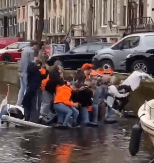 The moment part-goers started to leap to safety as the boat started to sink