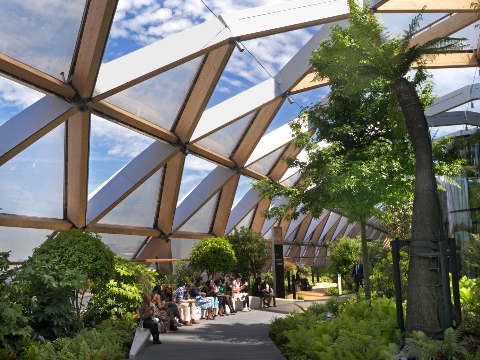 Tropical plants and hidden seating areas fill the gardens