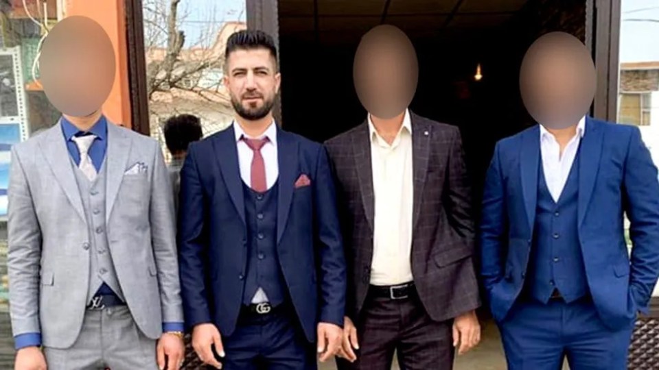 Majeed with his brothers, whose faces have been blurred
