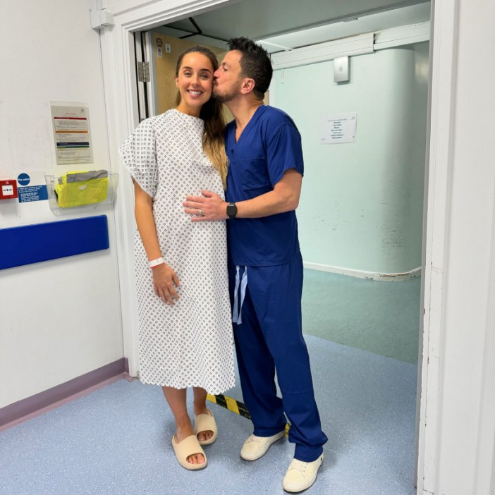 Peter Andre shares sweet snap kissing wife Emily before giving birth at hospital