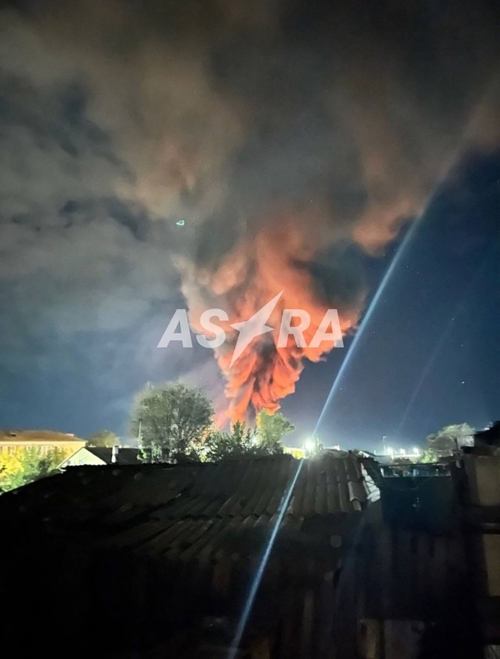 Think black smoke can be seen billowing in the sky after the strike