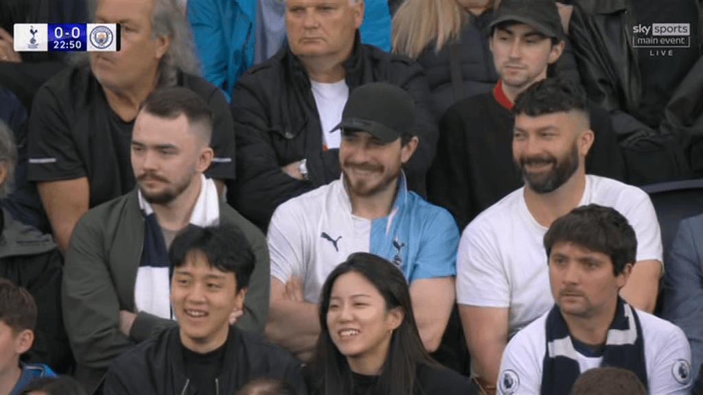The two-tone top of the man in the middle clearly suggested his loyalties were divided during Tuesday's crunch game