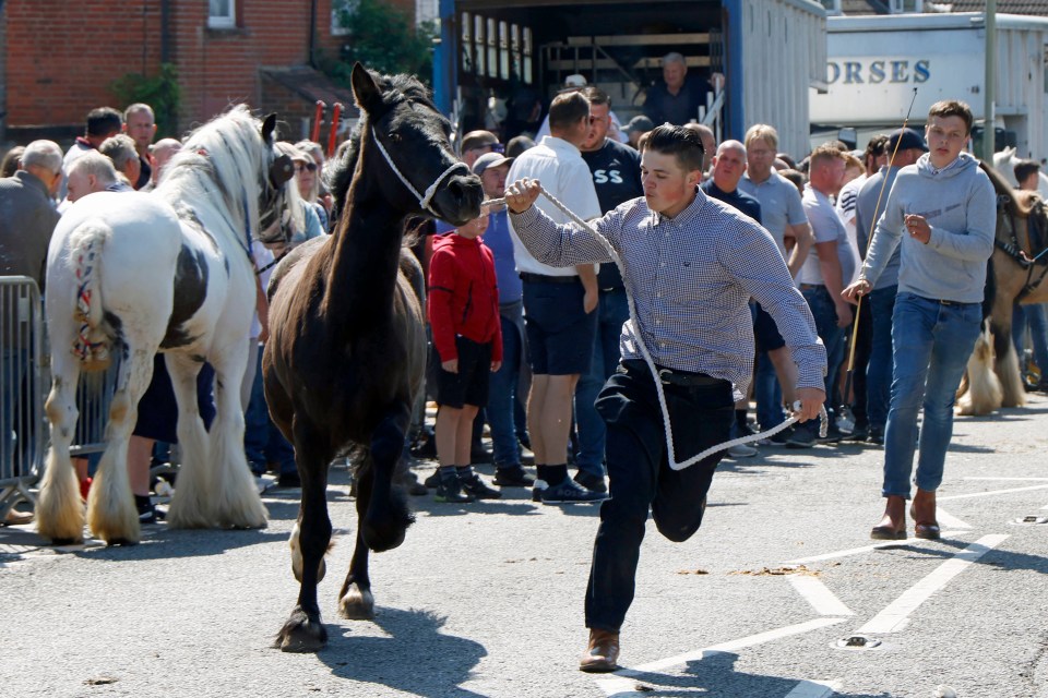 Two young lads help put a show for the watching crowds