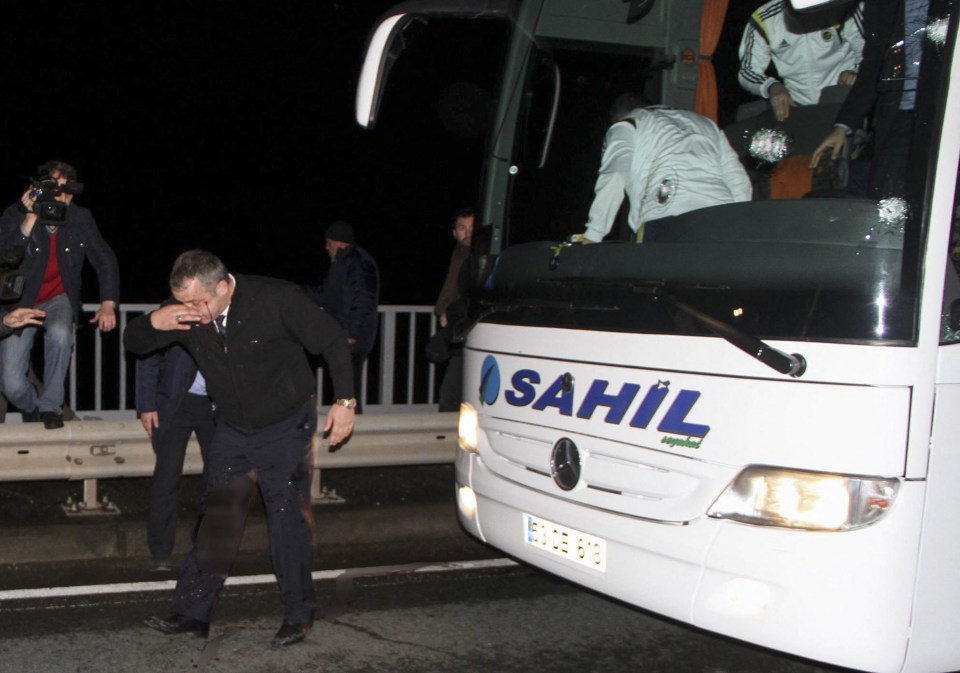 a white sahil bus is parked on the side of the road