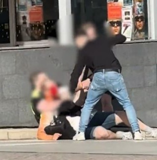 Unverified footage online appeared to show heroic bystanders, possibly including a security guard, tackling the knifeman