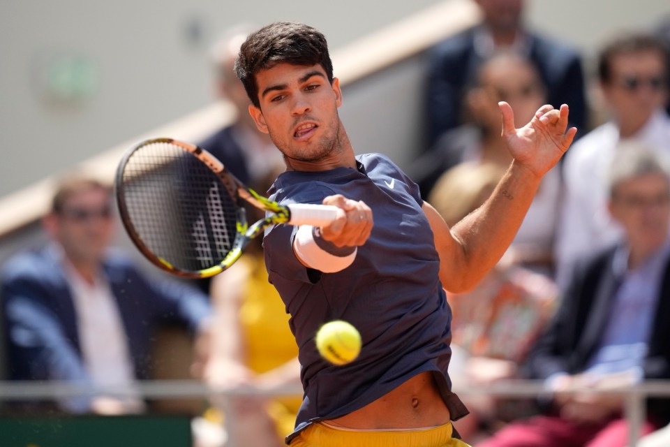 Spain's Carlos Alcaraz plays a shot against Germany's Alexander Zverev during the men's final of the French Open tennis tournament at the Roland Garros stadium in Paris, France, Sunday, June 9, 2024. (AP Photo/Christophe Ena)