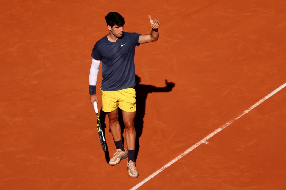 PARIS, FRANCE - JUNE 07: Carlos Alcaraz of Spain gestures to a spectator in the crowd as he plays against Jannik Sinner of Italy during the Men's Singles Semi-Final match on Day Thirteen of the 2024 French Open at Roland Garros on June 07, 2024 in Paris, France. (Photo by Dan Istitene/Getty Images)