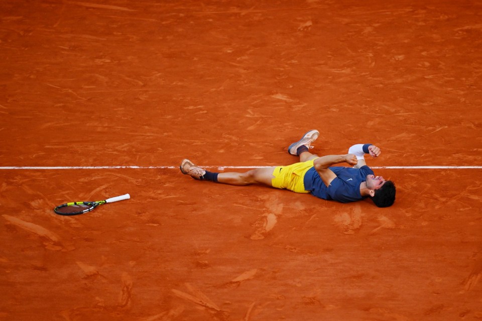 PARIS, FRANCE - JUNE 09: Carlos Alcaraz of Spain celebrates winning match point against Alexander Zverev of Germany during the Men's Singles Final match on Day 15 of the 2024 French Open at Roland Garros on June 09, 2024 in Paris, France. (Photo by Tim Goode/Getty Images)