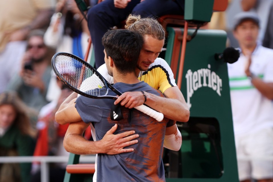 PARIS, FRANCE - JUNE 09: Carlos Alcaraz of Spain hugs Alexander Zverev of Germany after the Men's Singles Final match on Day 15 of the 2024 French Open at Roland Garros on June 09, 2024 in Paris, France. (Photo by Dan Istitene/Getty Images)