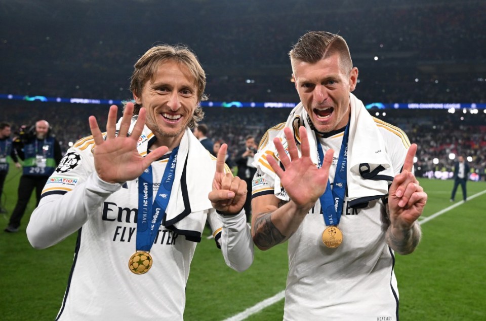 LONDON, ENGLAND - JUNE 01: Luka Modric and Toni Kroos of Real Madrid pose for a photo as they celebrate with their winner's medals following the team's victory during the UEFA Champions League 2023/24 Final match between Borussia Dortmund and Real Madrid CF at Wembley Stadium on June 01, 2024 in London, England. (Photo by Michael Regan - UEFA/UEFA via Getty Images)